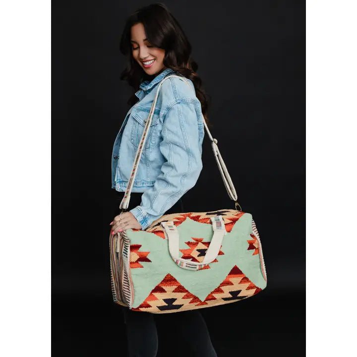 Discover Panache Apparel Co. Mint & Multicolored Aztec Duffel Quality Panache Apparel Co. Duffel Bag located at The Revival.